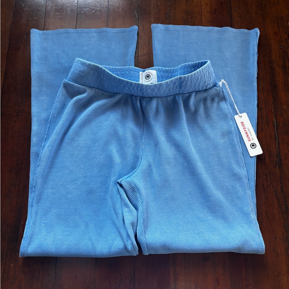 Baby blue flare pants. Smoke free and with tags.